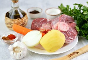Телячья ножка с овощами в духовке